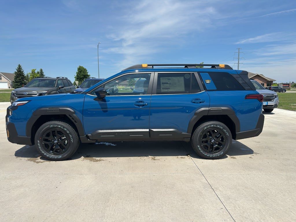 2026 Subaru OUTBACK Wilderness in Geyser Blue — front three-quarter view