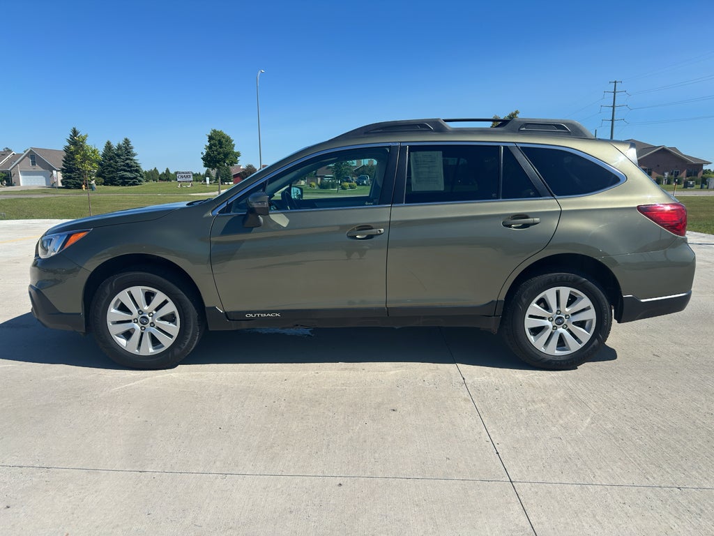 2017 Subaru Outback Premium in Wilderness Green Metallic — front three-quarter view