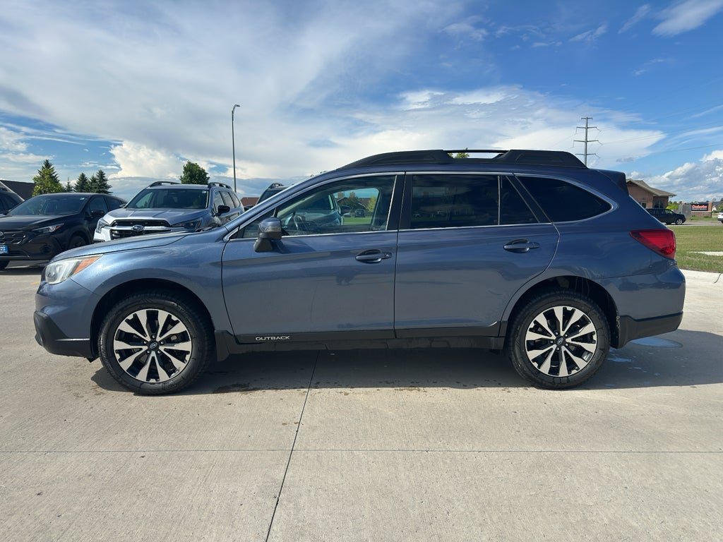 2016 Subaru Outback 2.5i Limited in Twilight Blue Metallic — front three-quarter view