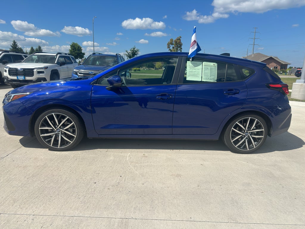 2026 Subaru Impreza Sport in Sapphire Blue Pearl — front three-quarter view