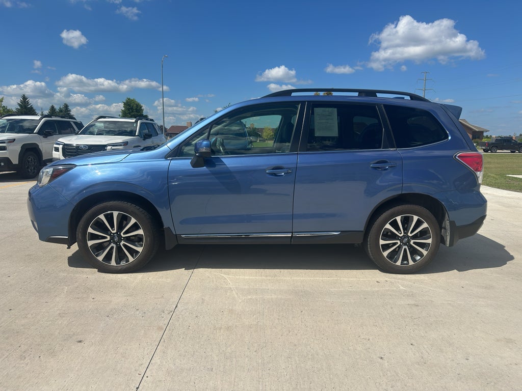 2017 Subaru Forester Touring in Quartz Blue Pearl — front three-quarter view