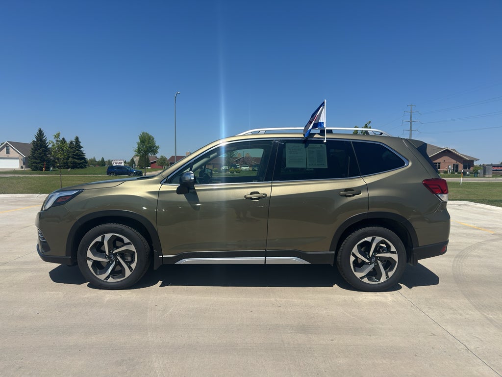 2023 Subaru Forester Touring in Autumn Green Metallic — front three-quarter view